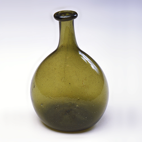 green glass bottle from late 19th century